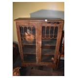 TWO DOOR BOOKCASE AS FOUND FINISH FADED .