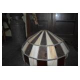 STAINED GLASS LAMP HAS FEW DAMAGED PANELS .