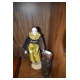 PORCELAIN DOLL AND WOOD FIGURE .