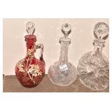 TWO DECANTERS CRANBERRY ONE CHIPPED