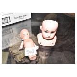 PORCELAIN DOLL HEAD AND CUPIE DOLL.