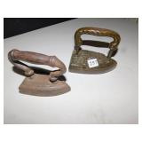 2 IRONS, 1 HAS A SAILOR ANCHOR ON IT