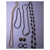 STRAND OF PEARLS, SILVER PEARLS, BLACK AND GOLD