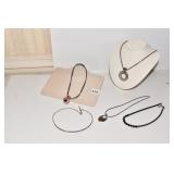 LEATHER BAND WITH AMBER AND RHINESTONE PENDANT,