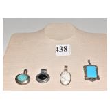 FOUR NECKLACE PENDANTS IN 925 SILVER