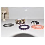 FIVE BRACELETS INCLUDING GLASS BEADS, TRIPLE