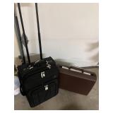 SUITCASE TALL HANDLE AND WHEELS AND BRIEFCASE.