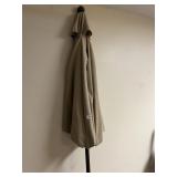 TAN PATIO UMBRELLA W/ PLASTIC STAND