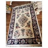 27" X 52" WOOL AREA RUG W/ FRINGE FLOWER DESIGN