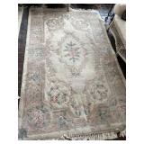 WOOL AREA RUG 59" X 102" CREAM BACKGROUND