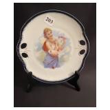 PORCELAIN PLATE WITH WOMAN AND FLOWER, G M BROWN