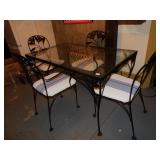 GLASS TOP IRON PATIO TABLE 28"H 50"L 31"W WITH 4