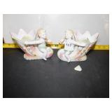 2 PORCELAIN CHERUBS SITTING ON HORNS