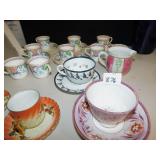 GROUP OF TEACUPS WITH SAUCERS, CREAMER, SUGAR,