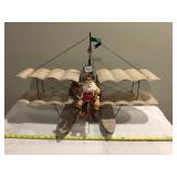 TIN AND WIRE SANTA ON PONTOON BIWING PLANE,