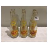 6 PACK OF REGENT BOTTLING COMPANY BOTTLES, 7 OZ,