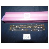 SUZANNE SOMERS MULTISTRAND GOLD TONE AND