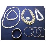 FOUR BRACELETS, TRIPLE STRAND BEADED NECKLACE,