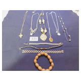 GROUP WITH SIX NECKLACES, PENDANTS, RHINESTONES,