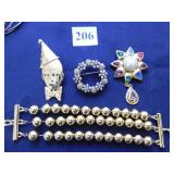 GOLD TONE TRIPLE STRAND BEADED BRACELET AND THREE