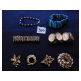 FOUR BRACELETS INCLUDING BLUE SHELL, RHINESTONES