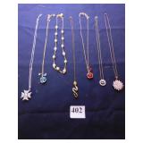 GROUP OF PENDANT NECKLACES SNAKE, RED AND BLUE