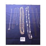 GROUP OF CHAIN NECKLACES, ONE WITH OCTOPUS