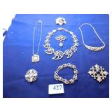 GOLD TONE NECKLACE WITH CUTOUT NAUTILUS LINKS,