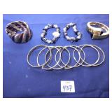 SET OF SEVEN GOLD TONE BRACELETS, BEADED WATCH