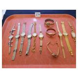 GROUP OF TWELVE GOLD TONE AND SILVER TONE LADIES