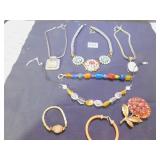 THREE NECKLACES WITH PENDANTS, BEADED BRACELET,