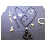 BLACK GLASS BEADED NECKLACE WITH TASSEL PENDANT,