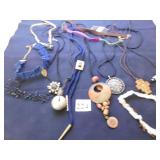 GROUP OF NECKLACES MADE OF FABRIC, CORDING,