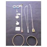 THREE PENDANT NECKLACES ONE AMBER COLOR