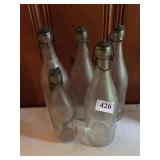 FIVE BOTTLE WITH LOCKING STOPPERS