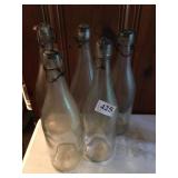 FIVE BOTTLE WITH LOCKING STOPPERS