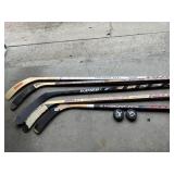HOCKEY STICKS AND PUCKS