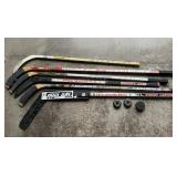 HOCKEY STICKS AND PUCKS