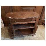 DOUBLE SIDED MAGAZINE RACK WITH SHARED DRAWER,