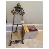 METAL EASEL 33" H WITH FIGURAL WOMAN ON TOP AND