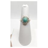 GOLD AND DIAMOND RING WITH PECTOLITE CENTER STONE