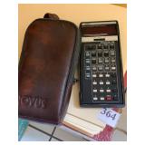 NOVUS CALCULATOR WITH CASE AND MANILLA FOLDERS
