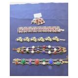 FOUR BRACELETS ONE WITH RED STONES AND PIN TO