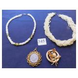 TWO PEARL NECKLACES ONE WITH TINY PINK AND GREEN