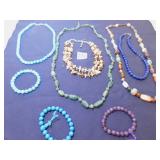 GROUP OF POLISHED STONE NECKLACES AND BRACELETS,