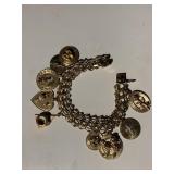 14K GOLD CHARM BRACELET 34.7 DWT AND