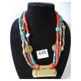 FOUR STRAND BOHO BEADED NECKLACE WITH LARGE GOLD