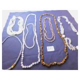 GROUP OF BEADED NECKLACES, POLISHED STONE, TIGER