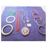 GROUP OF BANGLE BRACELETS AND THREE NECKLACES ONE