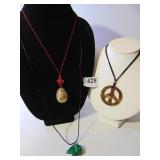 ENAMELED EGG ON RED CORDING WITH ORIENTAL KNOT